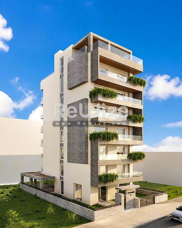 Σύγχρονο κτίριο κατοικιών στη Χαλκιδική με πράσινα μπαλκόνια και σύγχρονη αρχιτεκτονική.